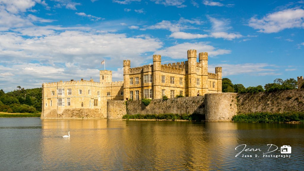 A view of Leeds Castle near the water. 