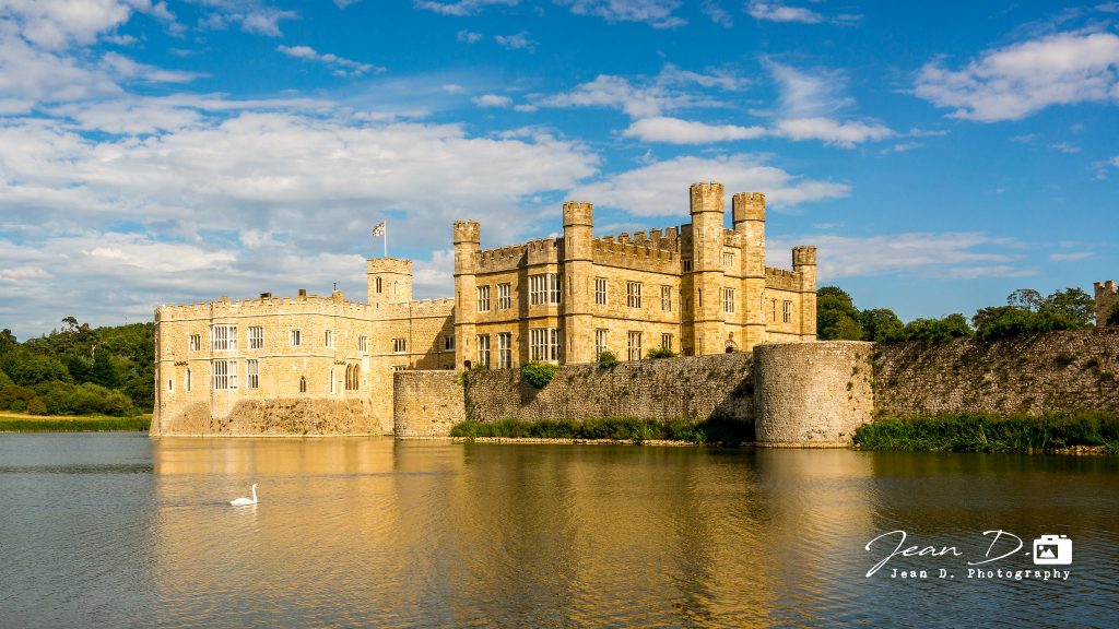 A view of Leeds Castle near the water.