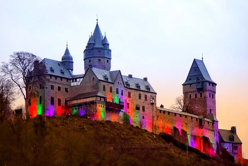 Altena Castle during sunset in colorful exterior lighting.