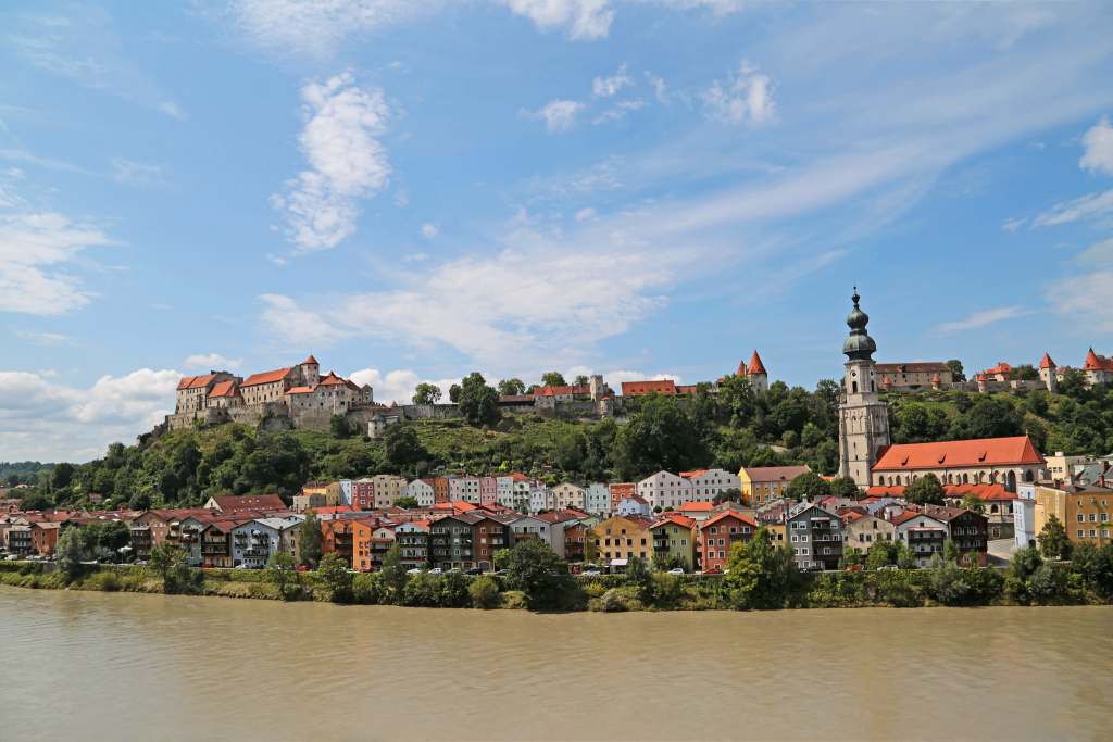 A view of the Burghausen Castle from across the river Salzach in the morning.