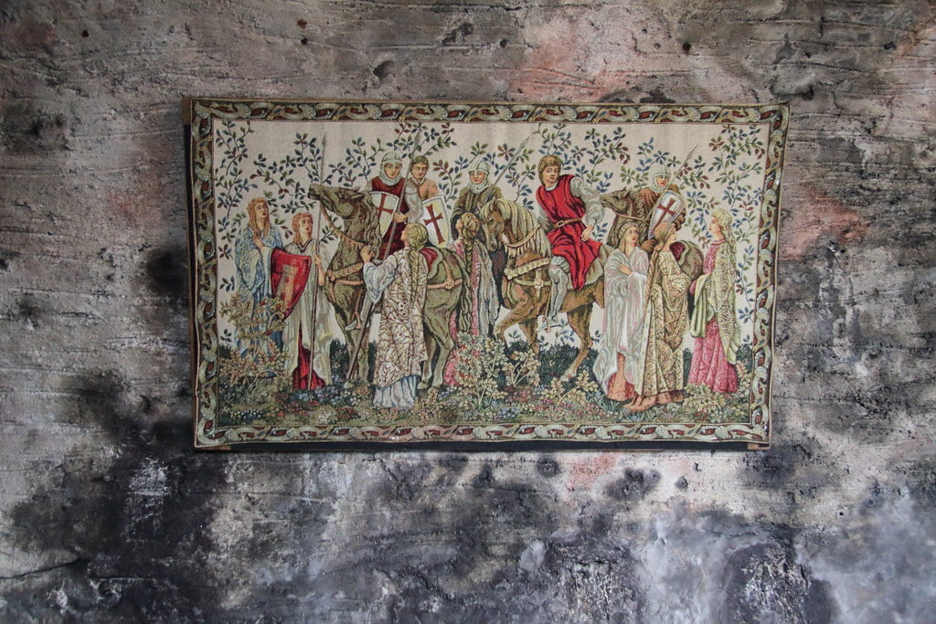 One of the wall paintings found in Dunguaire Castle showing men in horses talking to ladies.