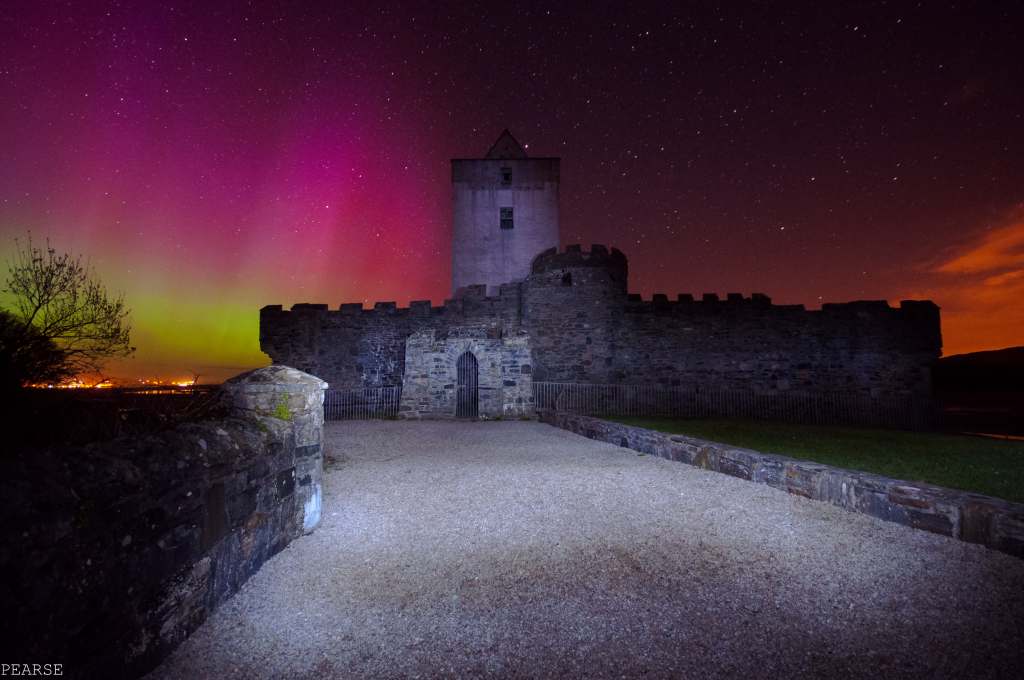 The beautiful Aurora Borealis over Doe Castle in Ireland.