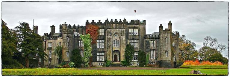 The best front view of the stunning Birr Castle with a huge green field in front of it.