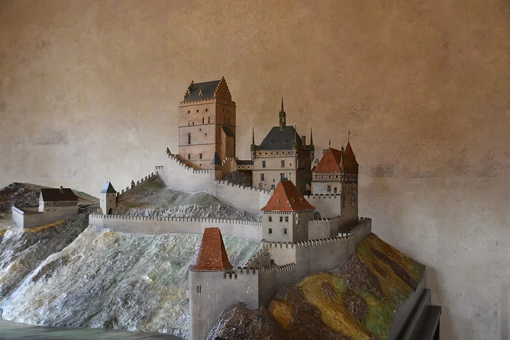 A scaled model of Karlštejn Castle and a closer look at its mountainous geography.