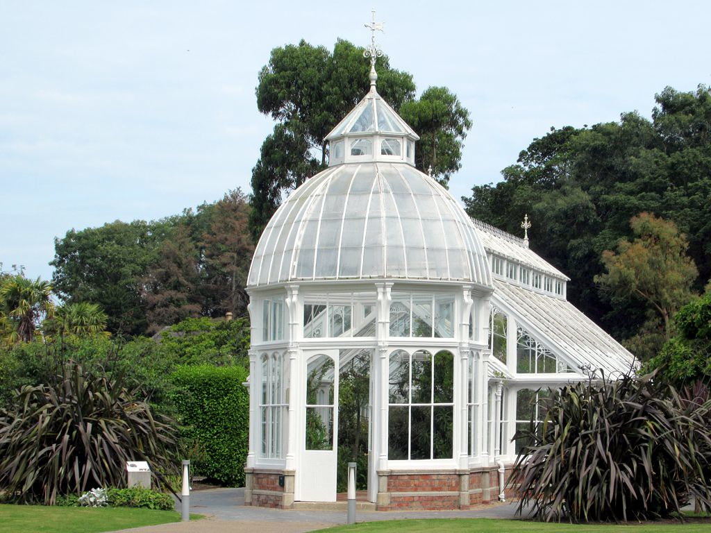 The beautiful Victoria House surrounded by trees in the Walled Garden at Malahide Castle.