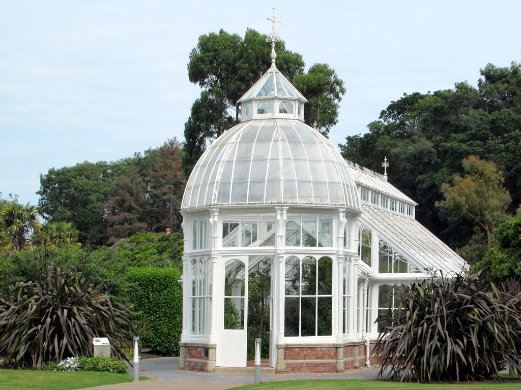 The beautiful Victoria House surrounded by trees in the Walled Garden at Malahide Castle.
