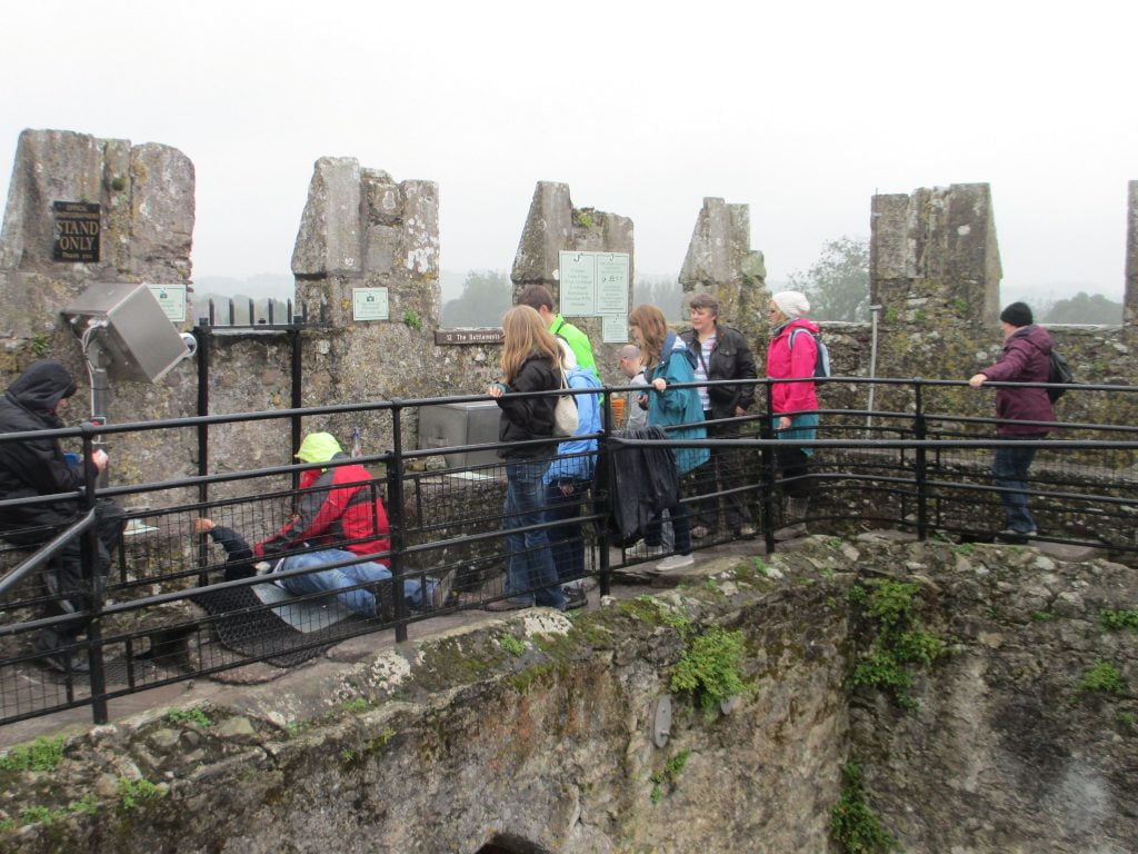 Kissing the Blarney Stone activity at the Blarney Castle. 