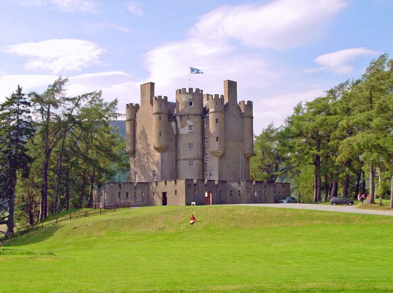 Braemar Castle surrounded by greens.