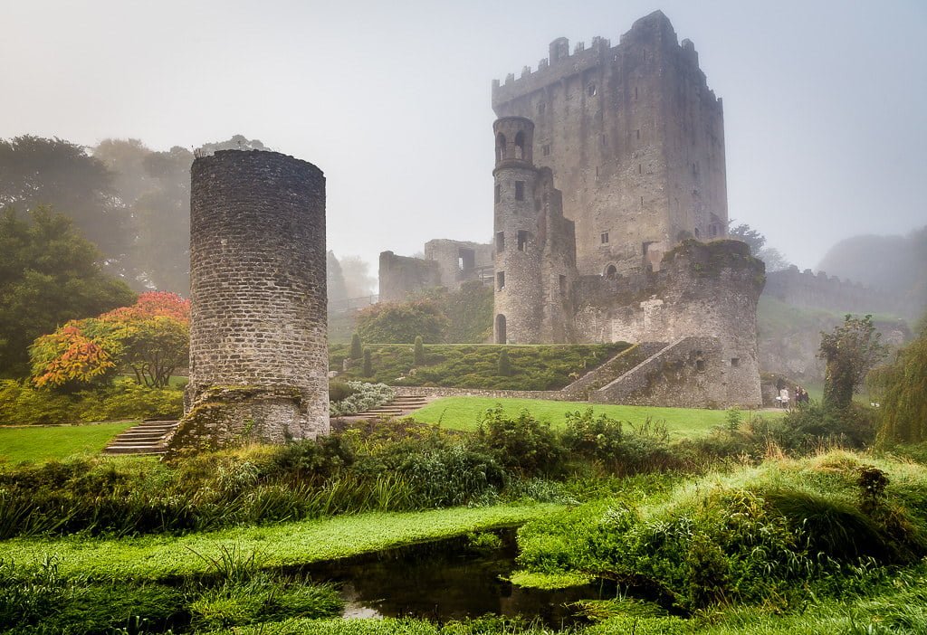 The Blarney Castle's view in the fog with green surroundings.