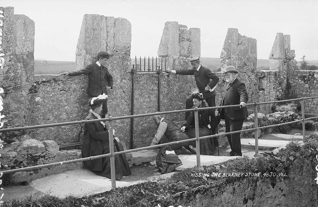 Kissing the Blarney Stone, around 1897.