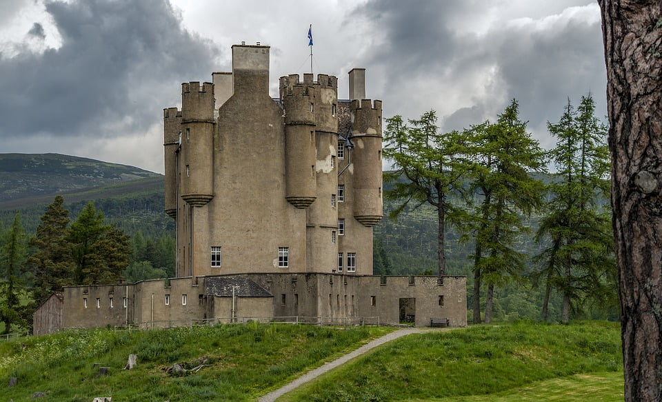 A view of Braemar with its star-shaped defensive walls, plain facade, and various turrets 