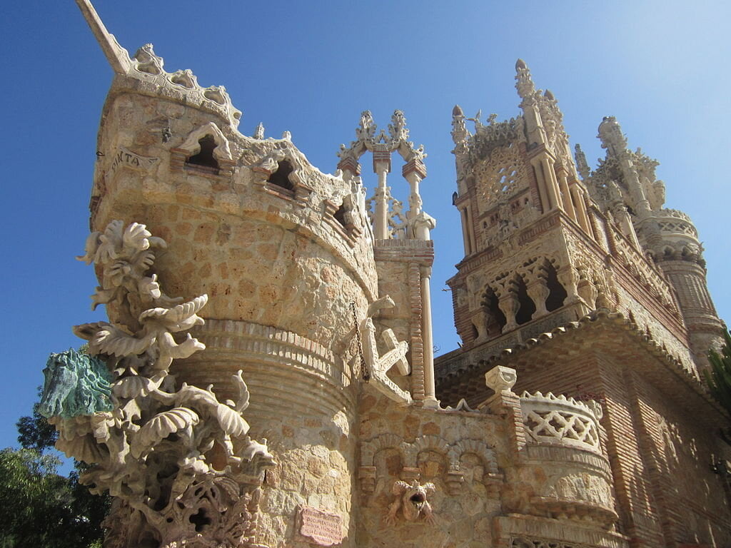 A sculpture of Columbus’s ship protruding out the side of the castle.