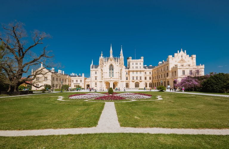 The beautiful view of Lednice Castle in front of the fountain.