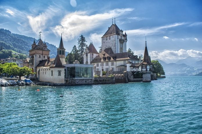 The Oberhofen Castle's view in the lake.
