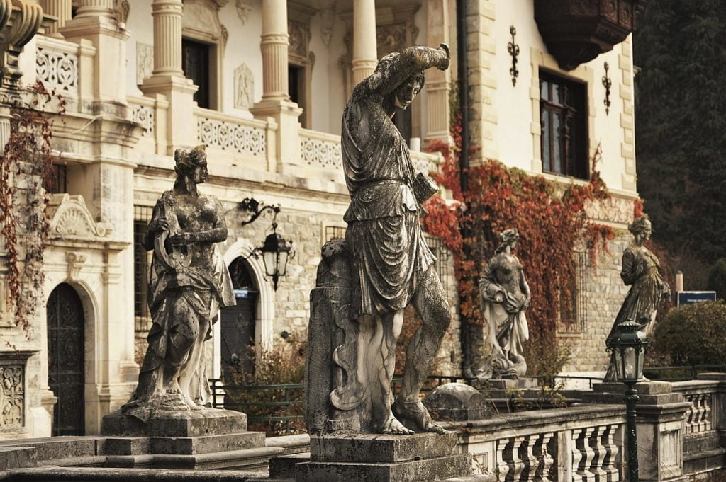 The sculptures of various notable personalities in Peles Castle’s gardens . 