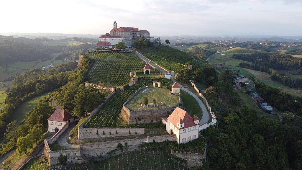 Aerial view of the foothill village and Riegersburg Castle. 