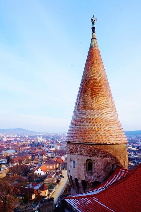 The tower of at Corvin Castle overlooks its surrounding community.