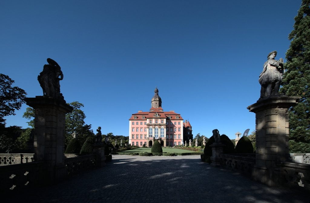 A view if Ksiaz Castle from afar showing the castle and its wide grounds.
