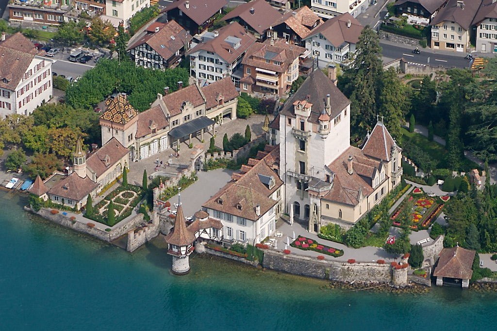An aerial view of the lakeside Schloss Oberhofen Castle. 
