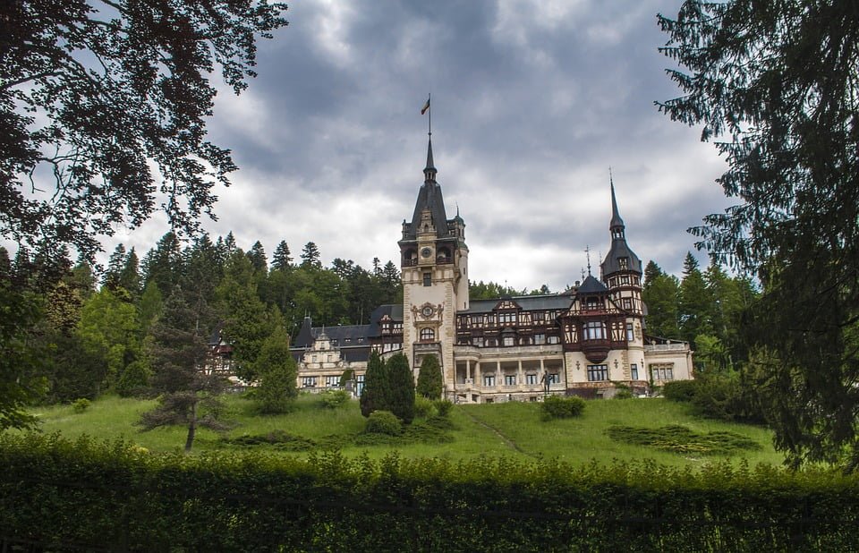 A beautifully framed photograph of Peles Castle and its surroundings in their current condition.