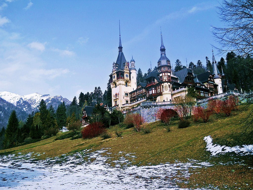 Peles Castle with winter frost on its grounds. 