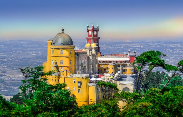 A picturesque view of Pena Palace in all its colorful glory.
