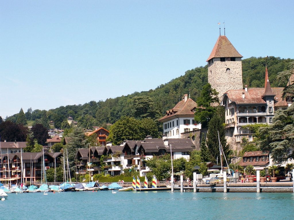 The side view of Spiez Castle across the lake. 