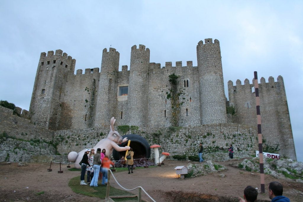 The Castle of Obidos surrounded by visiting tourists.