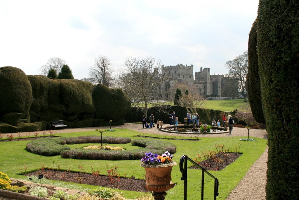 The garden with visiting tourists around near Raby Castle.