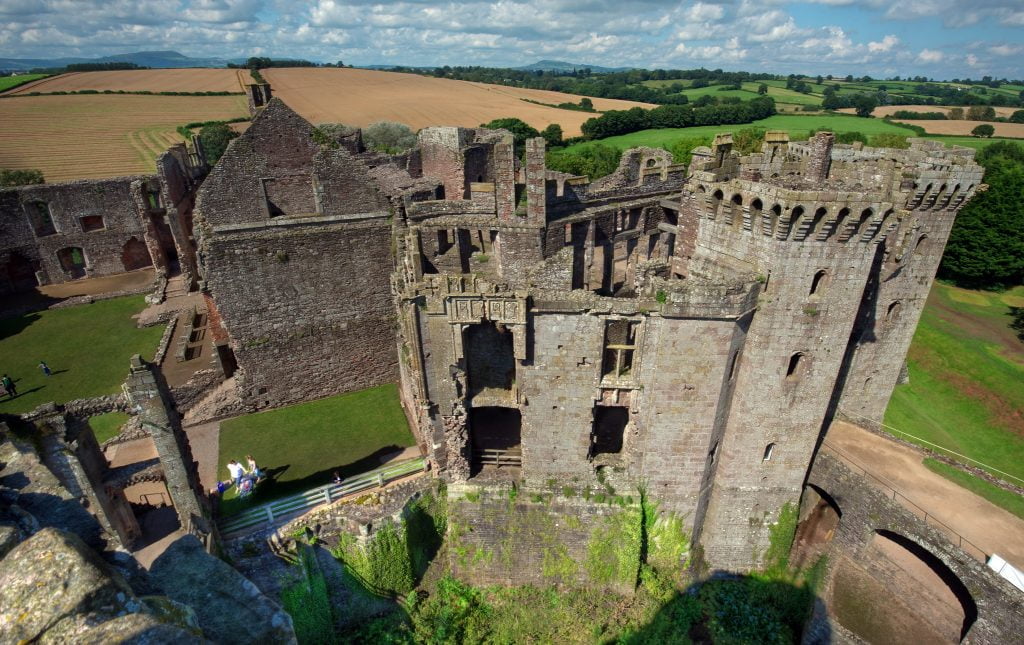 The aerial view of Raglan Castle flexing its structures. 