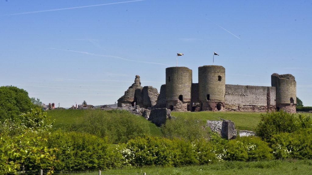 The mighty form and sturdy perch of Rhuddlan Castle.