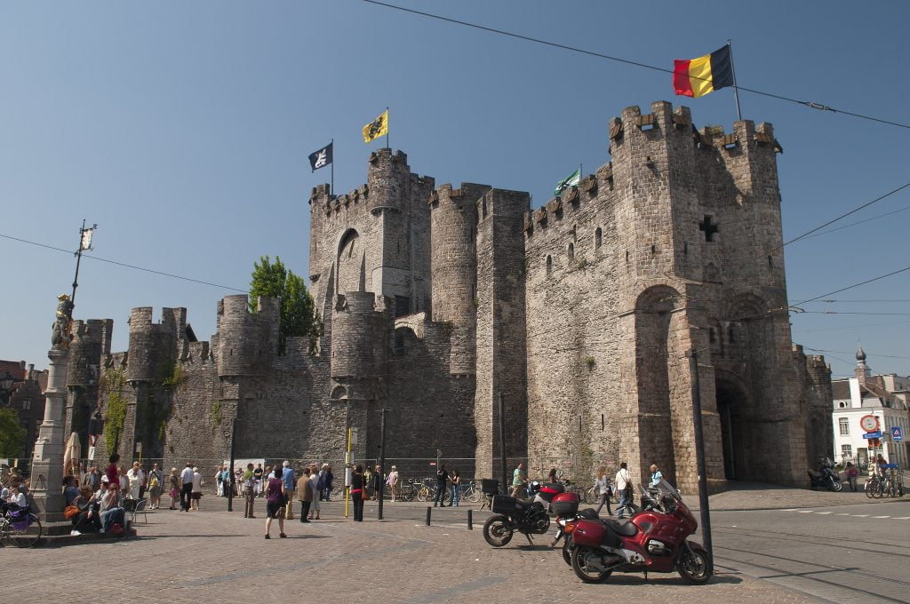 Visiting tourists surrounding Gravensteen Castle. 