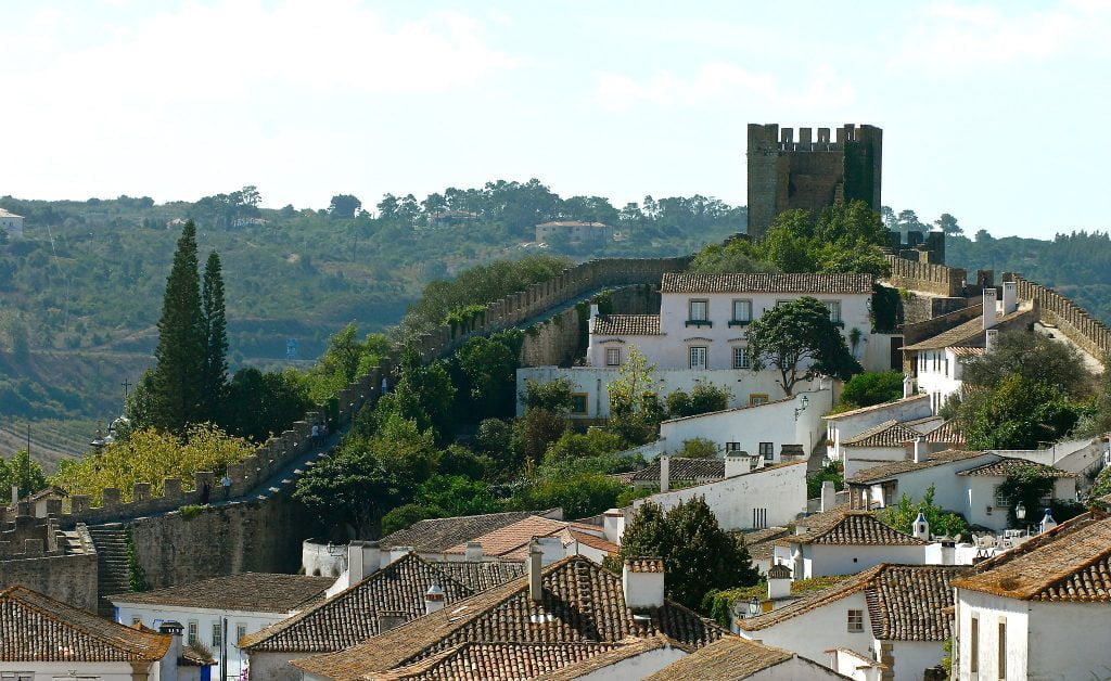 The walled town of Obidos with the castle beyond.