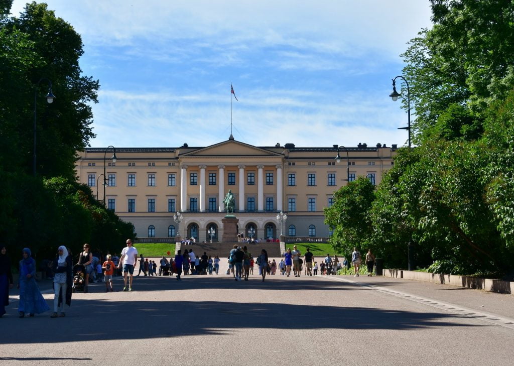 Visiting tourists around the Royal Palace of Oslo. 