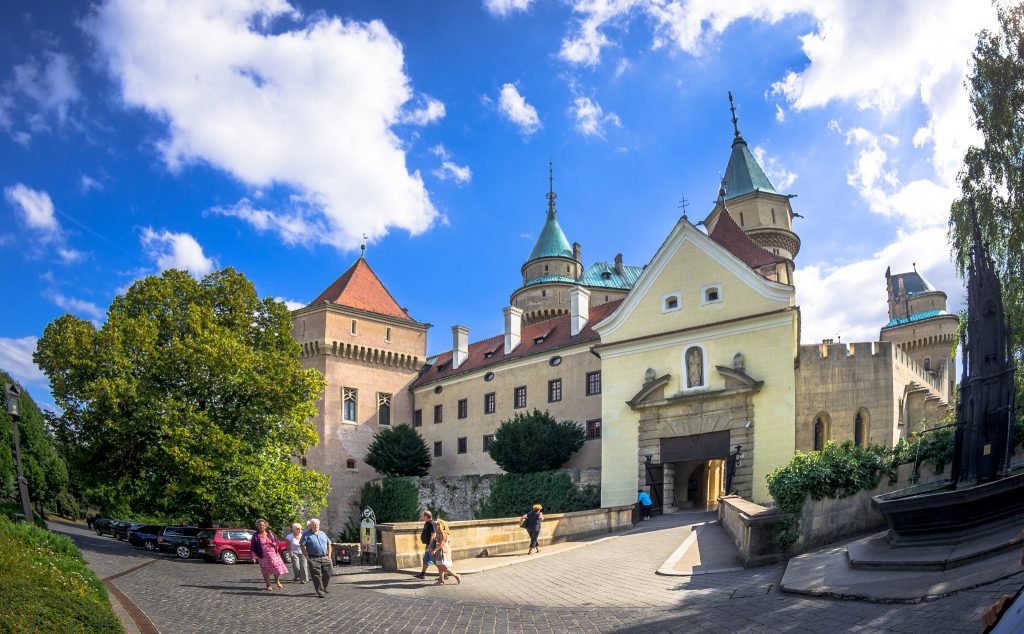 Bojnice Castle with visiting tourists around.
