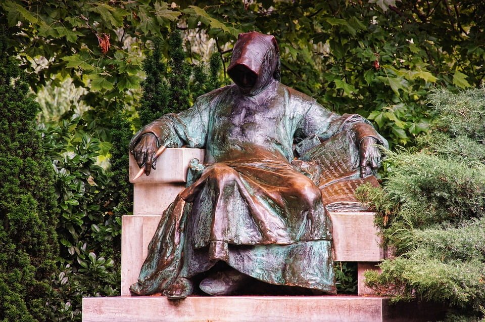 The statue of an anonymous writer in Vajdahunyad Castle.