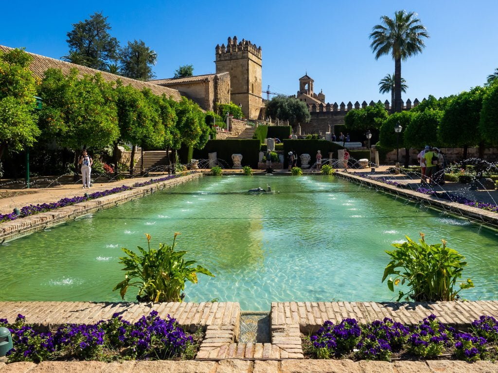 The beautiful garden in Alcázar de los Reyes Cristianos showing the fountain in the middle. 