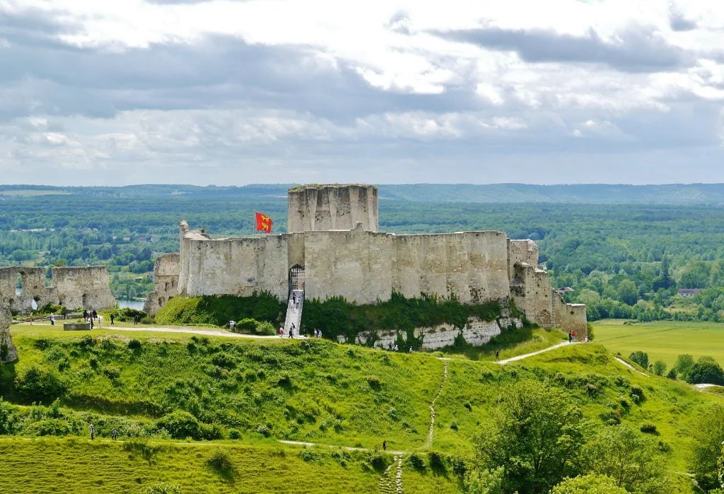 The beautiful view of Chateau Gaillard from afar. surrounded by greens.