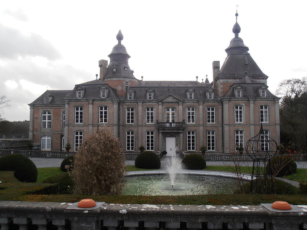 Chateau De Modave's entrance view on front of the fountain.