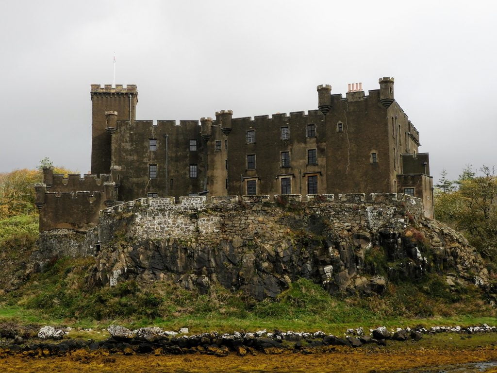 Dunvegan Castle standing at the hilltop. 