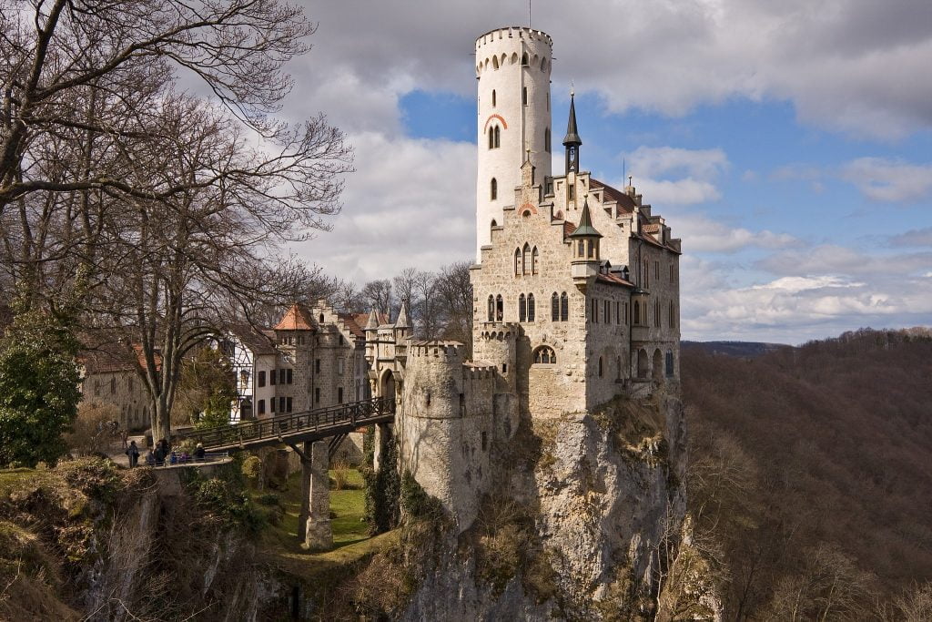 The Lichtenstein Castle's amazing view at the cliff showing the bridge and smaller buildings near the palace. 