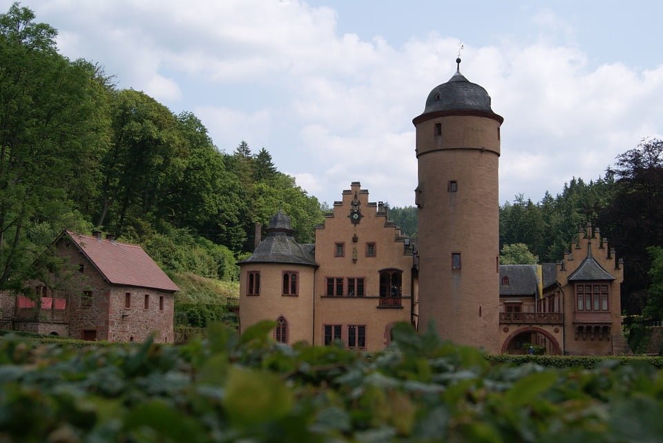 The front view of Mespelbrunn Castle and its tower