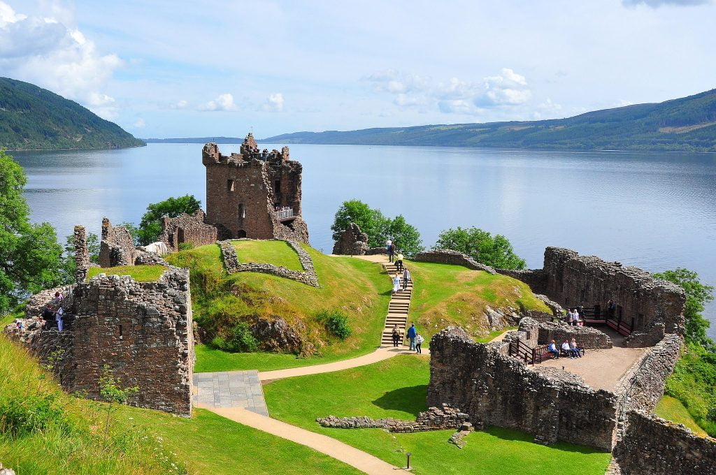 The beautiful scenery of ruins at Urquhart Castle near the water.
