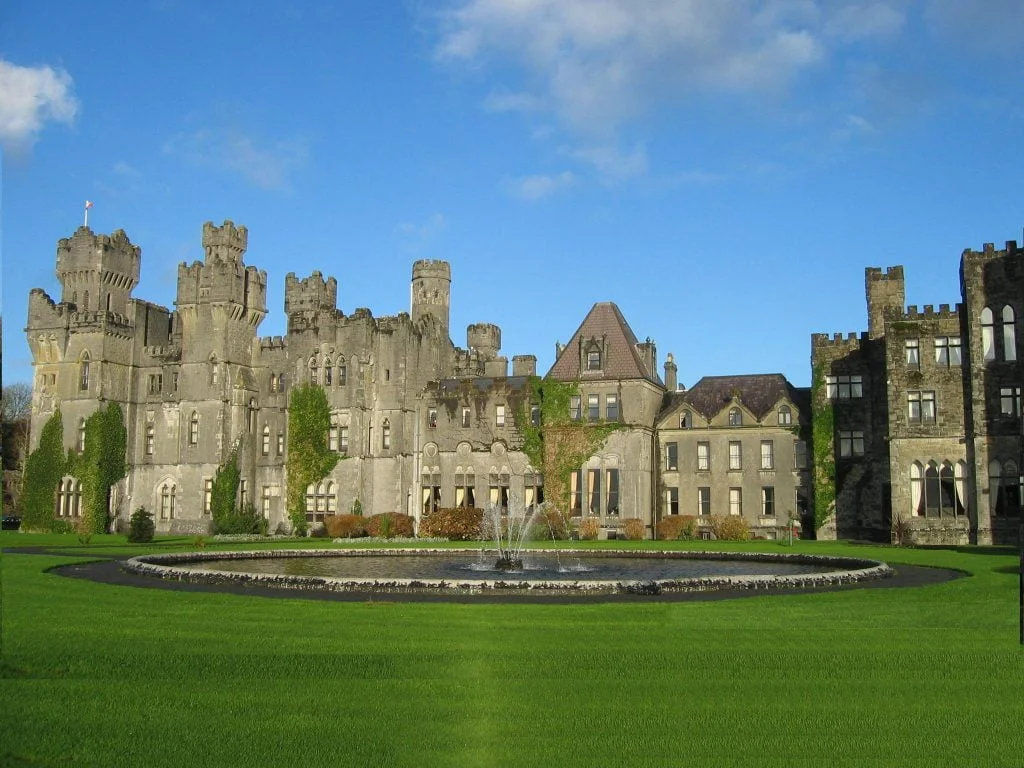 top 10 castles to visit in ireland The view of Ashford Castle in front of the castle's fountain.