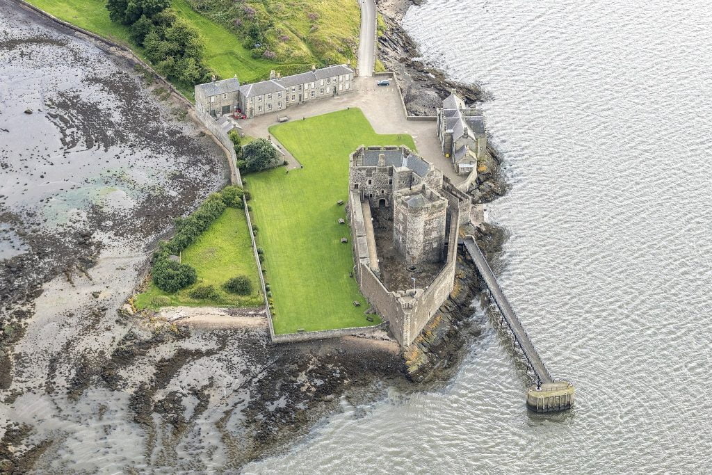 The aerial view of Blackness castle showing the full area and the sea.