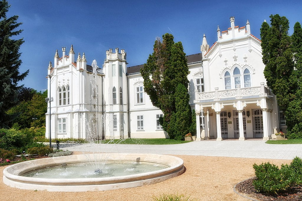 The beautiful luxurious structure of Brunszvik Mansion in front of the fountain.