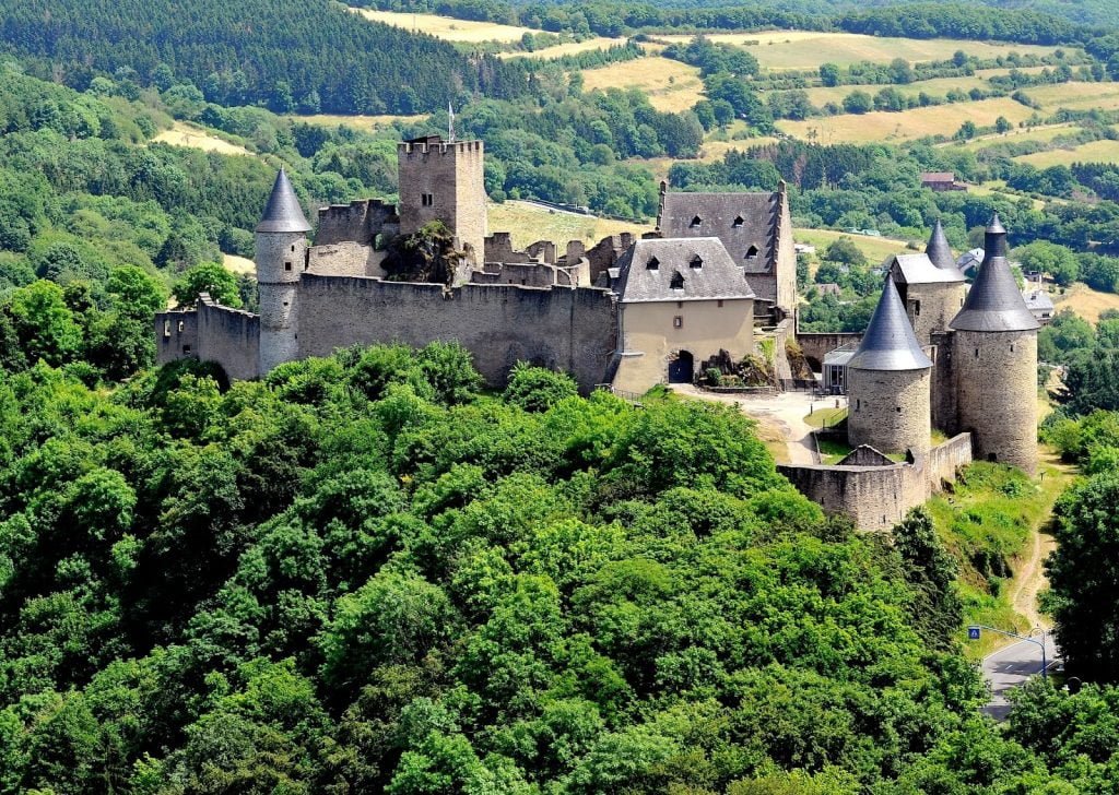 Vianden Castle surrounded by green trees