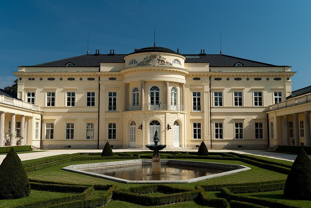 The beautiful facade of Karolyi castle in front of the fountain of the castle garden.
