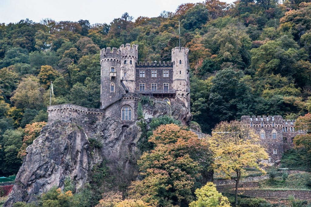 The iconic Rheinstein Castle standing at the hilltop.