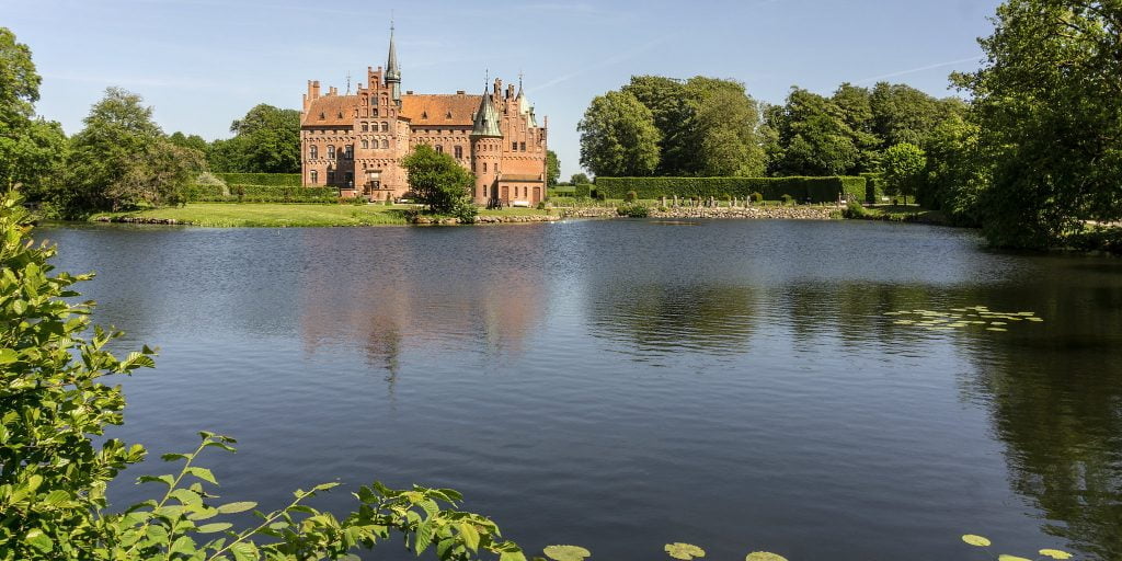 The scenic view of Egeskov Castle from afar.